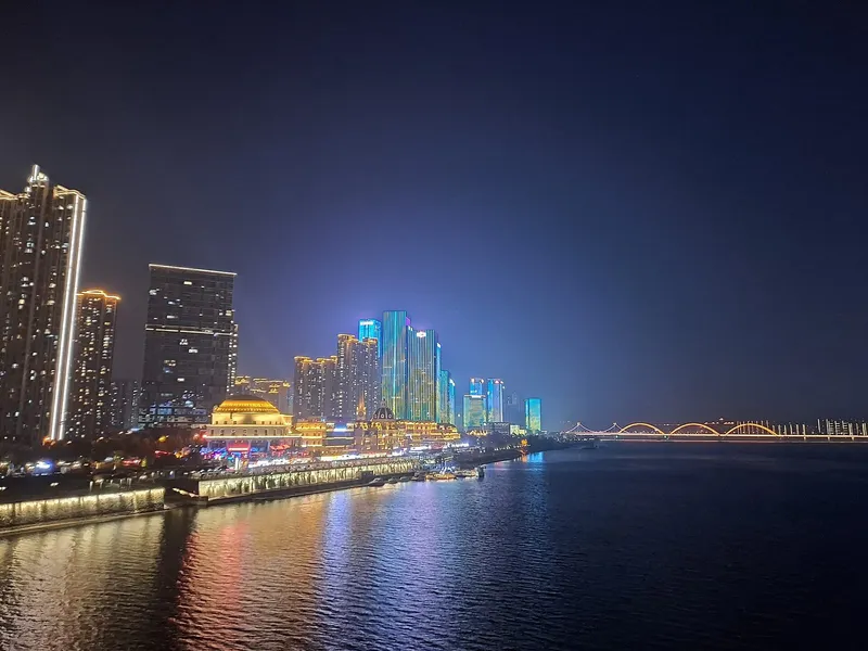 Changsha's illuminated skyline along the Xiangjiang River at night