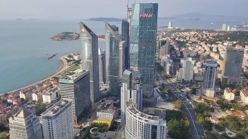 Qingdao's Zhanqiao Pier and red-roofed old town seen across Qingdao Bay