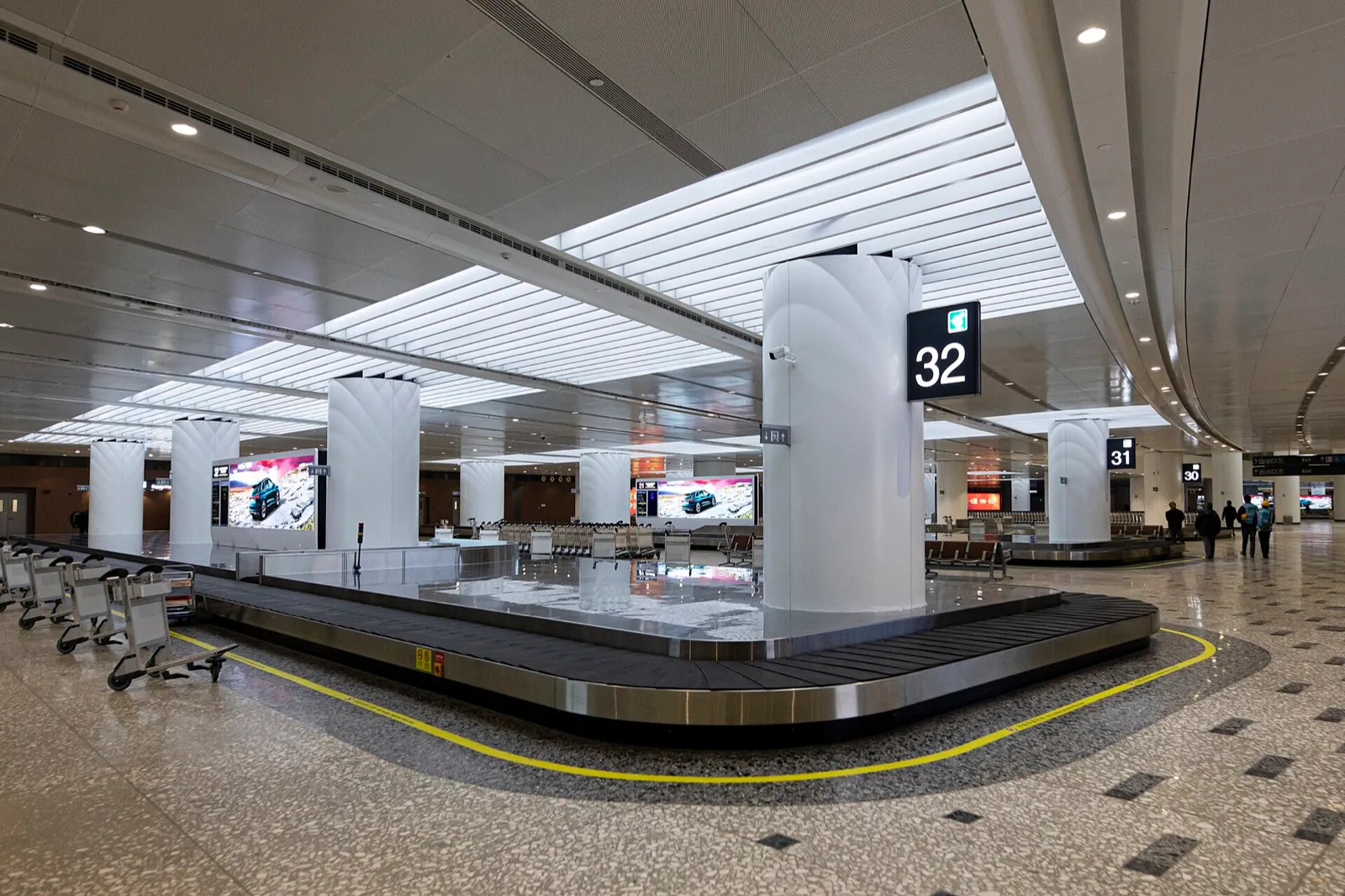 Passport and boarding pass on an airport counter with a departure board in the background